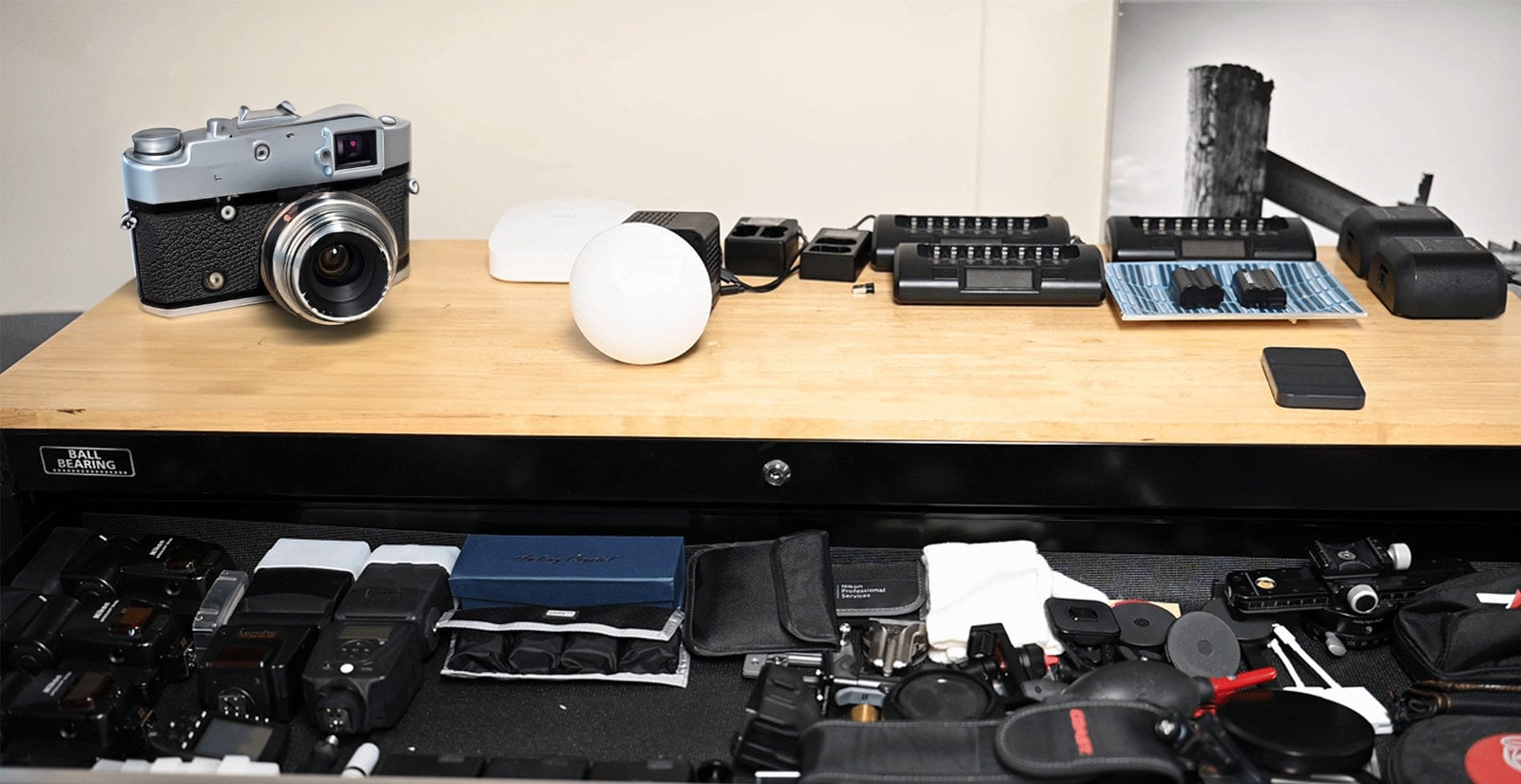 Collection of various photography equipment on desk.